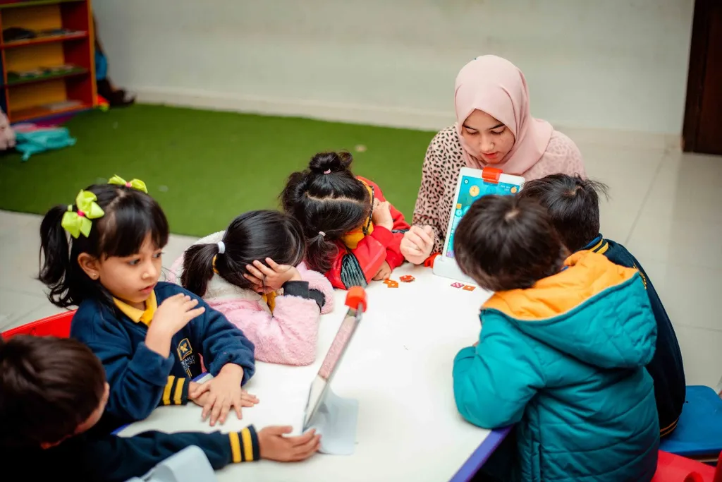 Teacher with young students in a hands-on learning session
