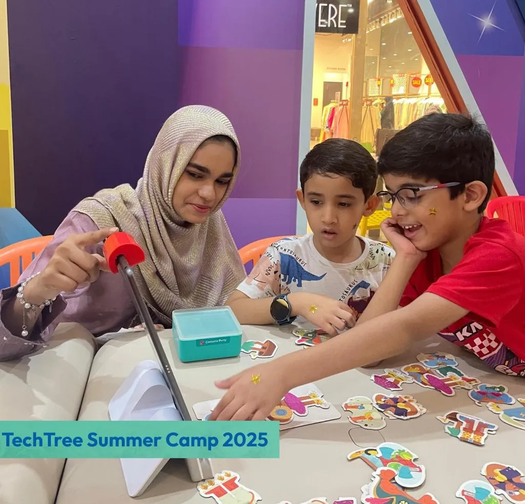 Instructor showing young students an interactive activity